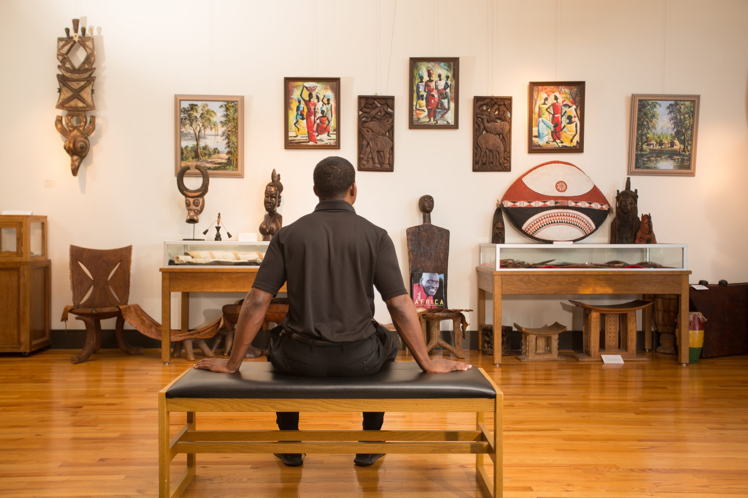 Young man sitting enjoying art at the black archives museum FAMU