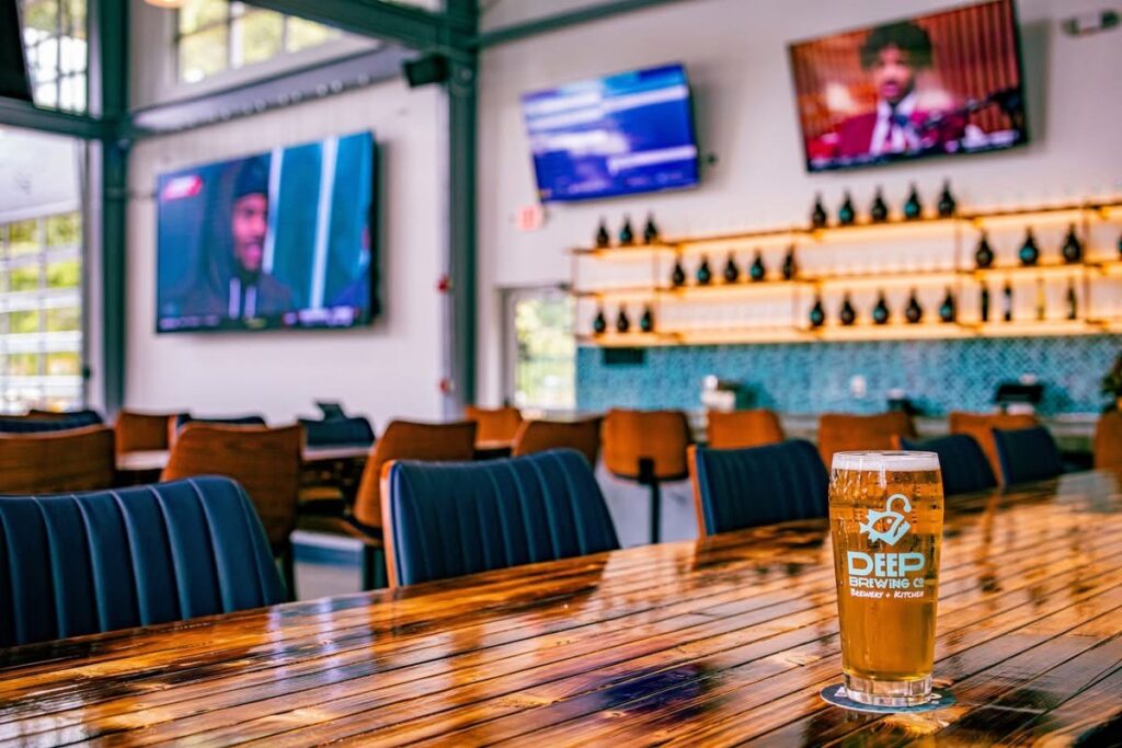 deep brewing company tap room with a beer on a table